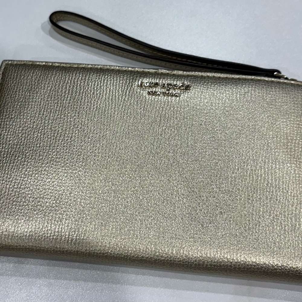 Kate spade gold metallic wristlet. Used once!